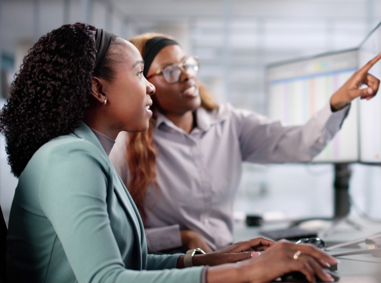 Centralized leasing operations image showing two people dscussing work